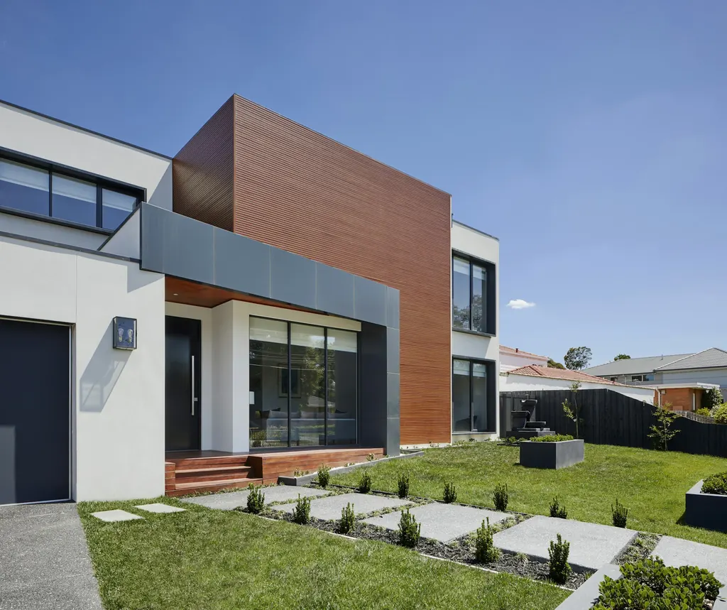 Contemporary two-story home with manicured lawn